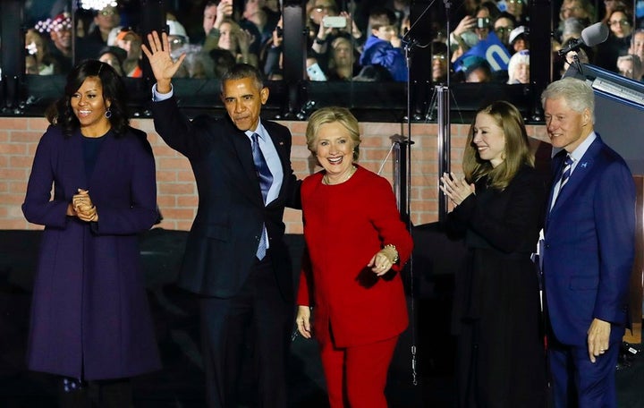 On the eve of the 2016 presidential election, an exuberant group of Democratic power players celebrates following a massive rally in Philadelphia. From left to right: Michelle and Barack Obama; Hillary, Chelsea, and Bill Clinton