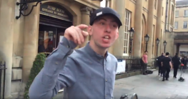 National Action deputy leader Alex Davies leaves Bath town square after being confronted.