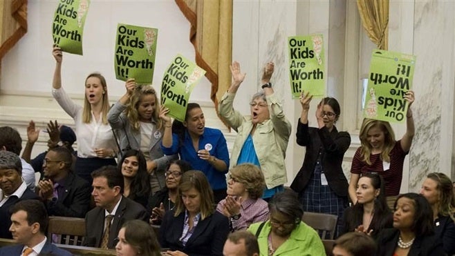 Audience members cheer after the Philadelphia City Council passed a tax on sugary and diet beverages in June. Geographic heal
