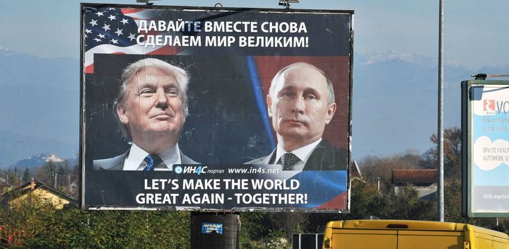 Cars pass by a billboard showing U.S. President-elect Donald Trump and Russian President Vladimir Putin placed by a pro-Serbian movement in the town of Danilovgrad on Nov. 16.
