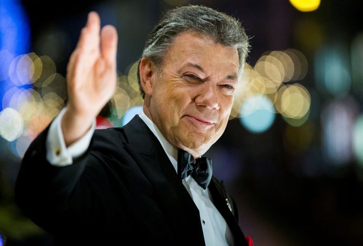 Nobel Peace Prize laureate Colombian President Juan Manuel Santos reacts to the torchlight parade from the balcony of the Grand Hotel in Oslo, Norway December 10, 2016. Santos called for the world to rethink the drug war while accepting the prize.