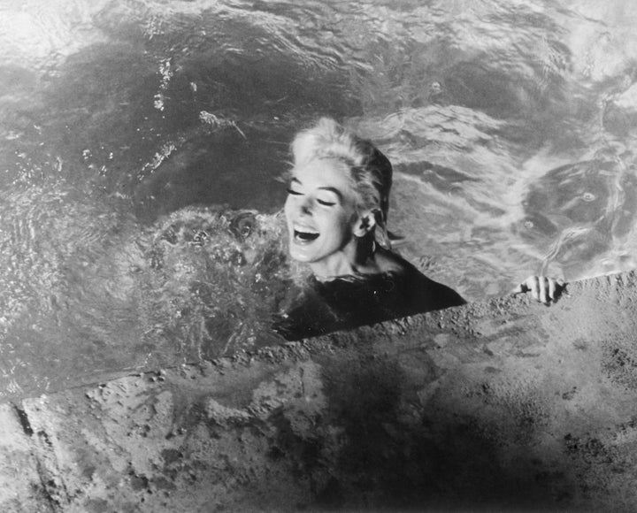 Marilyn Monroe, playing Ellen Arden, swims naked in "Something's Got to Give." The movie was never completed due to Monroe's sudden death during production.