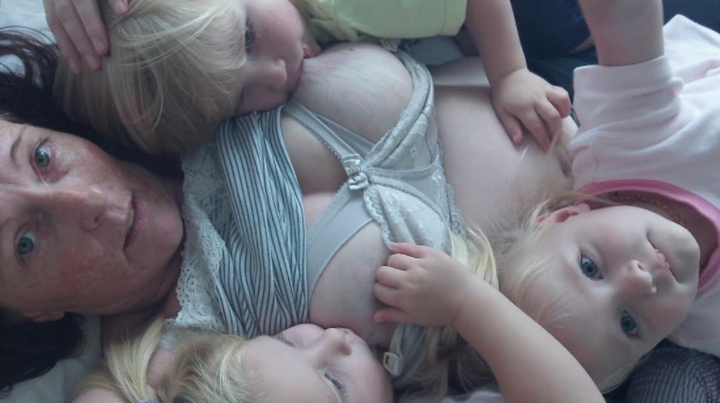 Davina Wright breastfeeding her triplets aged three.