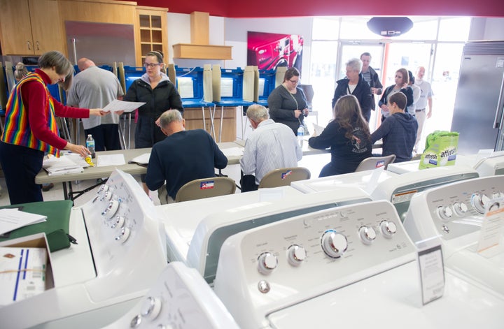 Voters cast their ballots in a polling location inside Mike's TV and Appliance November 8, 2016 in State College, Pennsylvania in the center of the state.