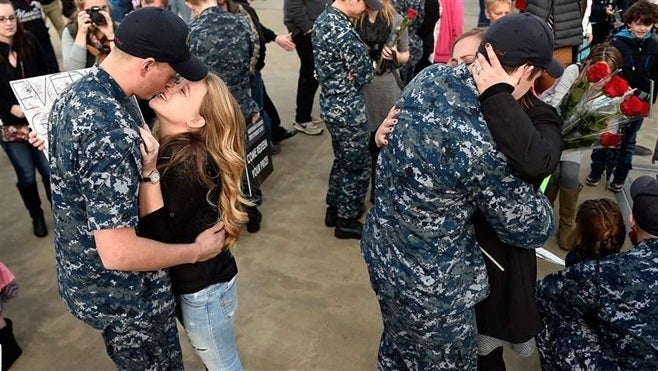 <p>Military families reunited last month at a Navy submarine base in Groton, Connecticut, following a deployment. Laws recently passed in all states were aimed at making it easier for military spouses to stay in their career as their families move from state to state.</p>