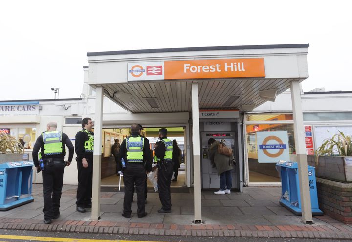 Police officers at Forest Hill train station, south east London.