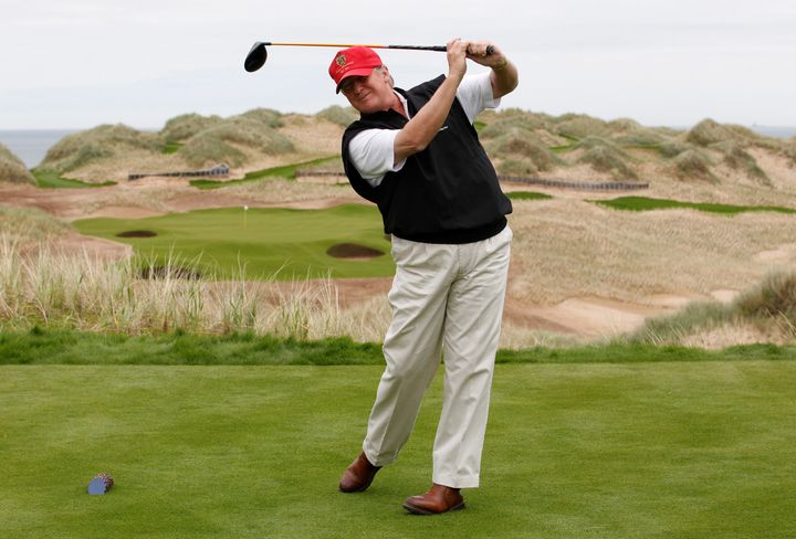 Trump practices his swing at the 13th tee of Trump International Golf Links course on the Menie Estate near Aberdeen, Scotland.