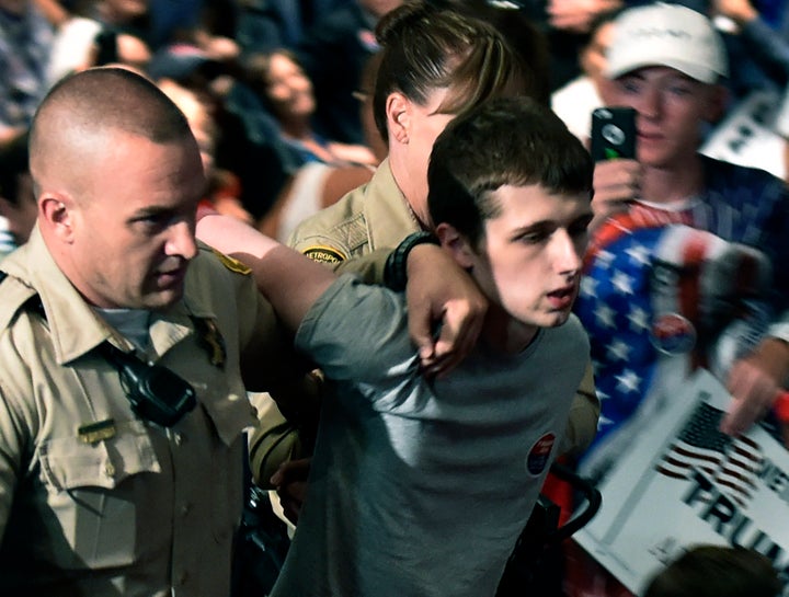 <strong>Las Vegas police lead Michael Sandford from the Trump's campaign rally in June.</strong>
