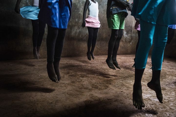 The mix of classical music, Mike's voice going, "One, Two, Three, Four!" and the colorful dresses turns the gray, cold room into a real ballet studio.