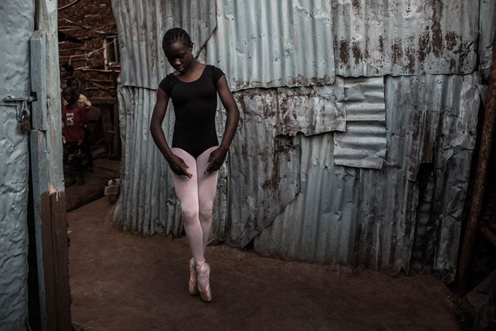 Pamela practicing ballet outside her family's house in Kibera.