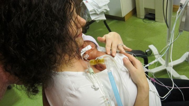 <p>(My first time holding my daughter at 1 month old)</p>