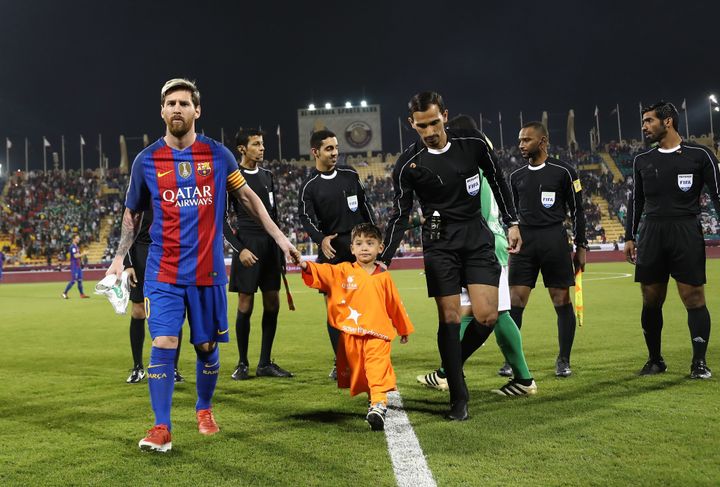 Murtaza Ahmadi takes to the pitch with his hero Lionel Messi