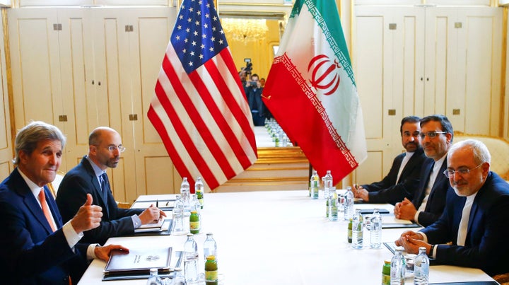 U.S. Secretary of State John Kerry, left, and Iran Foreign Minister Mohammad Javad Zarif attend a bilateral meeting in Vienna