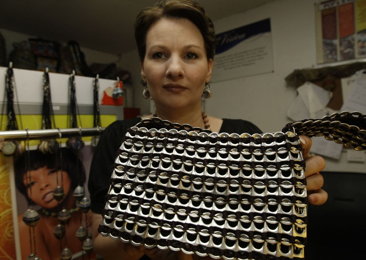 <strong>Jane Walker MBE holding one of the recycled products now assembled by prisoners in the UK</strong>