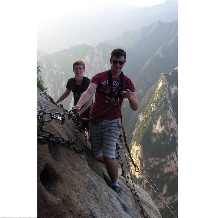 Matt climbing a mountain in China with friend John Logan in 2015 