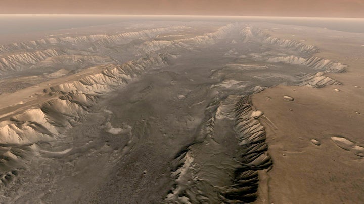 Mars' own Grand Canyon, Valles Marineris, is shown on the surface of the planet in this composite image made aboard NASA's Mars Odyssey spacecraft.