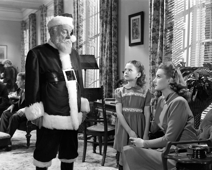 Left to right: Edmund Gwenn (1877 - 1959) as Kris Kringle, Natalie Wood (1938 - 1981) as Susan Walker and Maureen O'Hara as Doris Walker in 'Miracle On 34th Street', written and directed by George Seaton, 1947.