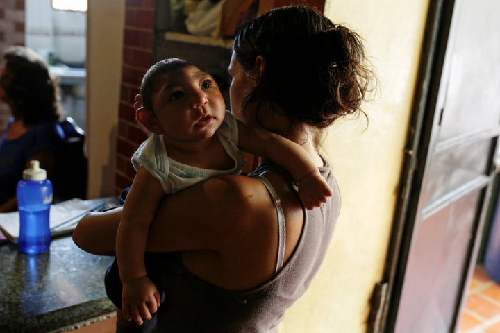 Ericka Torres holds her 3-months old son Jesus, who was born with microcephaly, at their home in Guarenas, Venezuela October 5, 2016. Picture taken October 5, 2016.