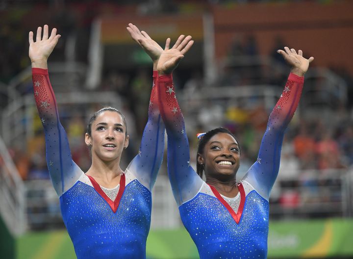 U.S. gymnasts Alexandra Raisman, left, and Simone Biles celebrate after winning Gold (Biles) and Silver (Raisman) in the Individual Women's Floor Exercise final at Rio Olympic Arena in Rio de Janeiro, Brazil, on Tuesday, Aug. 16, 2016.