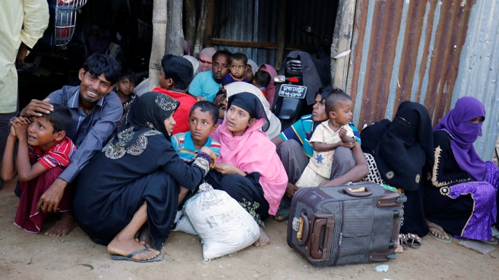 Rohingya Muslims cry as Border Guard Bangladesh (BGB) catch them in a check post in Cox’s Bazar, Bangladesh, November 21, 2016.