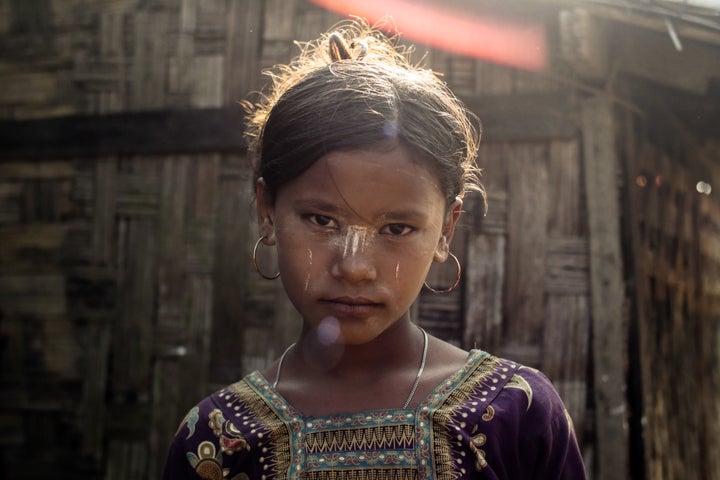 A Rohingya girl living in confinement outside of Site, Myanmar.