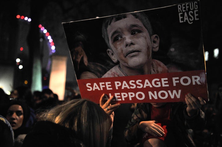 Protestors in London demand a safe passageway be opened for besieged Syrian civilians.