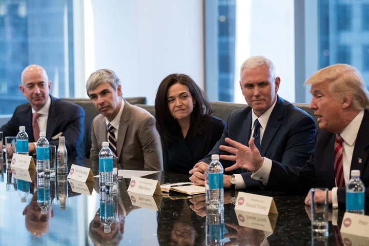 (L to R) Jeff Bezos, chief executive officer of Amazon, Larry Page, chief executive officer of Alphabet Inc. (parent company of Google), Sheryl Sandberg, chief operating officer of Facebook, Vice President-elect Mike Pence listen as President-elect Donald Trump speaks during a meeting of technology executives at Trump Tower, December 14, 2016 in New York City. (Photo by Drew Angerer/Getty Images)