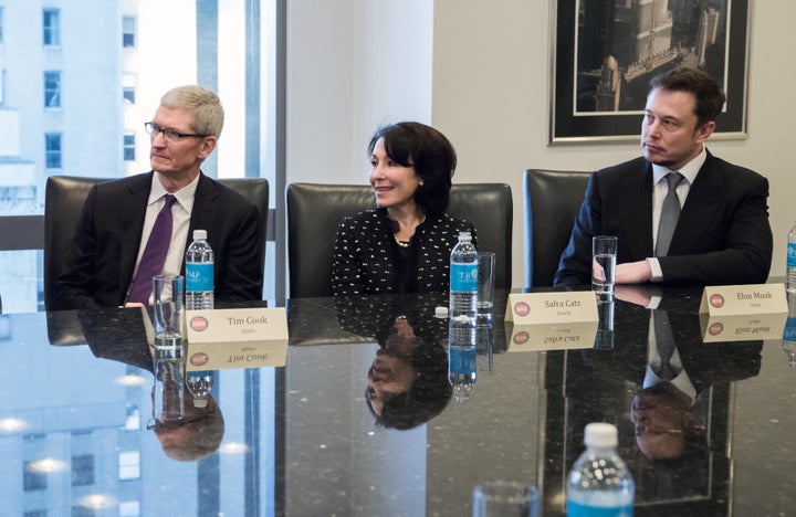 Tim Cook, chief executive officer of Apple Inc., from left, Safra Catz, co-chief executive officer of Oracle Corp., and Elon Musk, chief executive officer and co-founder of Tesla Motors Inc., listen during a meeting with U.S. President-elect Donald Trump and technology leaders at Trump Tower in New York, U.S., on Wednesday, Dec. 14, 2016. (Albin Lohr-Jones/Pool via Bloomberg)