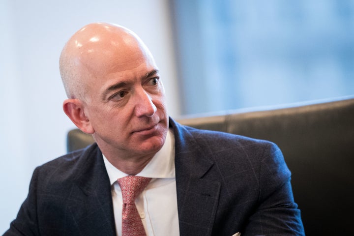 Jeff Bezos, chief executive officer of Amazon, listens during a meeting of technology executives and President-elect Donald Trump at Trump Tower, December 14, 2016 in New York City. (Photo by Drew Angerer/Getty Images)