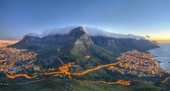 Table Mountain covered by its typical cloud table cloth and the twelve Apostles.