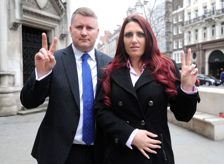 Paul Golding, leader of Britain First, and the party's deputy leader, Jayda Fransen, arrive at the Royal Courts of Justice in central London Thursday, where he is appearing in connection with an alleged breach of an injunction, relating to his activities around mosques