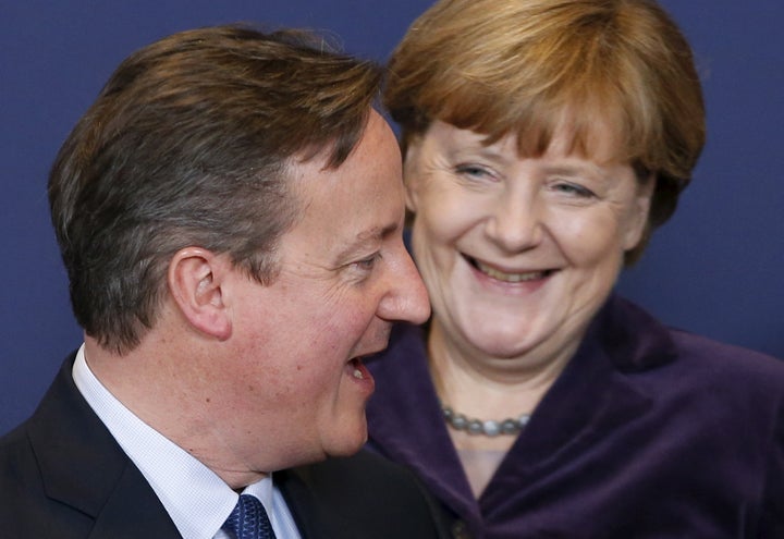 Former Prime Minister David Cameron has German chancellor Angela Merkel in hysterics during a photo session at the European Union leaders summit in Brussels on December 17