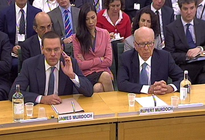 <strong>James Murdoch (left) and his father Rupert Murdoch giving evidence about phone hacking</strong>