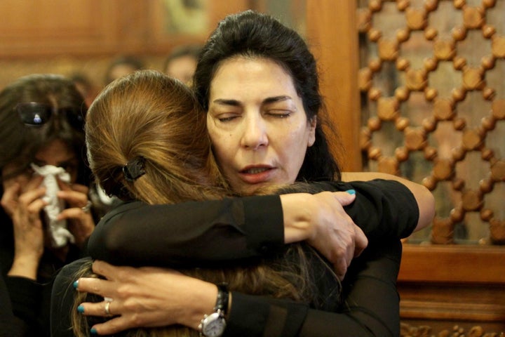 <strong>Relatives and friends of EgyptAir hostess Yara Hani, who was onboard Flight MS804 from Paris to Cairo shortly before it plunged into the Mediterranean, mourn during a ceremony at a church in Cairo</strong>