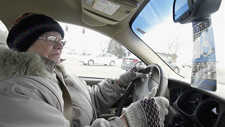 Dorothy Bierman makes a right turn while driving in DeKalb, Illinois. Licensing requirements for older drivers vary widely from state to state.