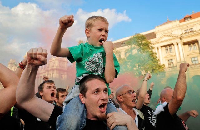 Supporters of Hungary’s policies on migration gesture during a concert by nationalist group Romantic Violence, on the eve of the referendum.