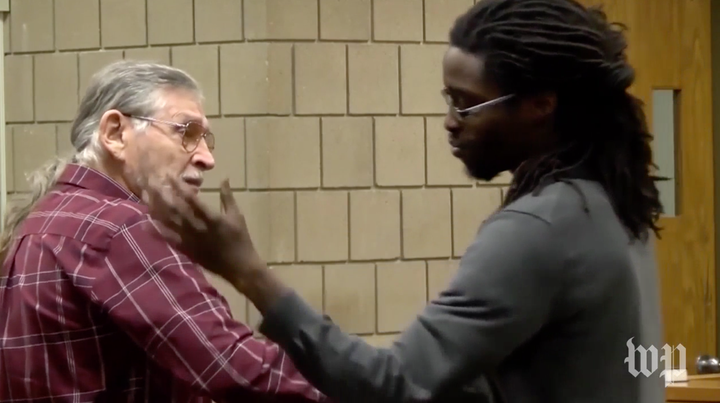 John Franklin McGraw (left) and Rakeem Jones shake hands in court.