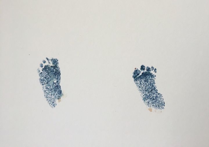 Hospital staff pressed Theodore's footprints to make a keepsake for Alexandra W.