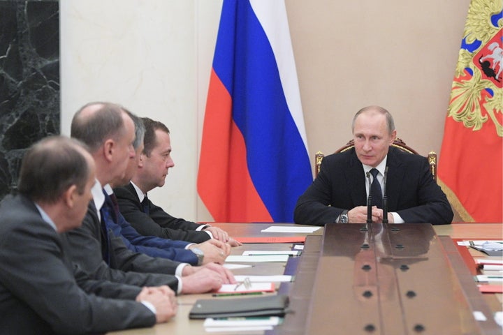 Russia's President Vladimir Putin and Russia's Prime Minister Dmitry Medvedev at a Russian Security Council meeting at the Mo