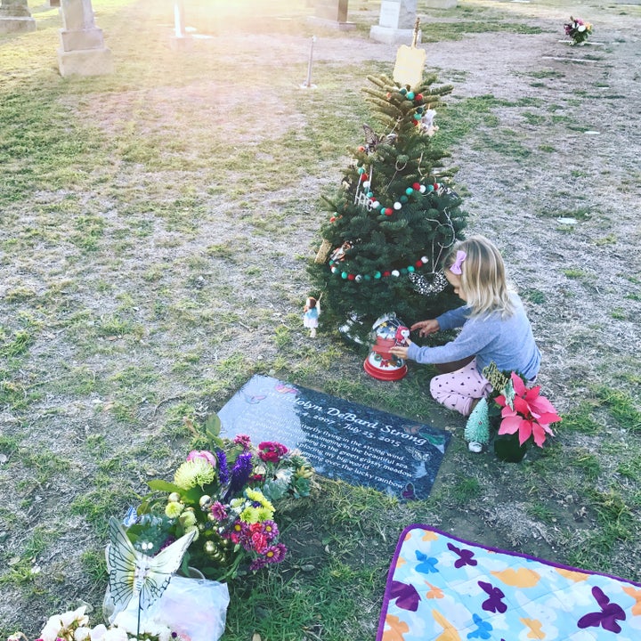 Decorating big sissy’s tree at the cemetery. 