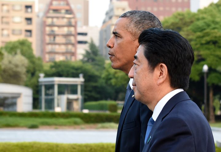 U.S. President Barack Obama and Japanese Prime Minister Shinzo Abe walk toward the Atomic Bomb Dome after laying a wreath in the Peace Memorial Park in Hiroshima on May 27, 2016.