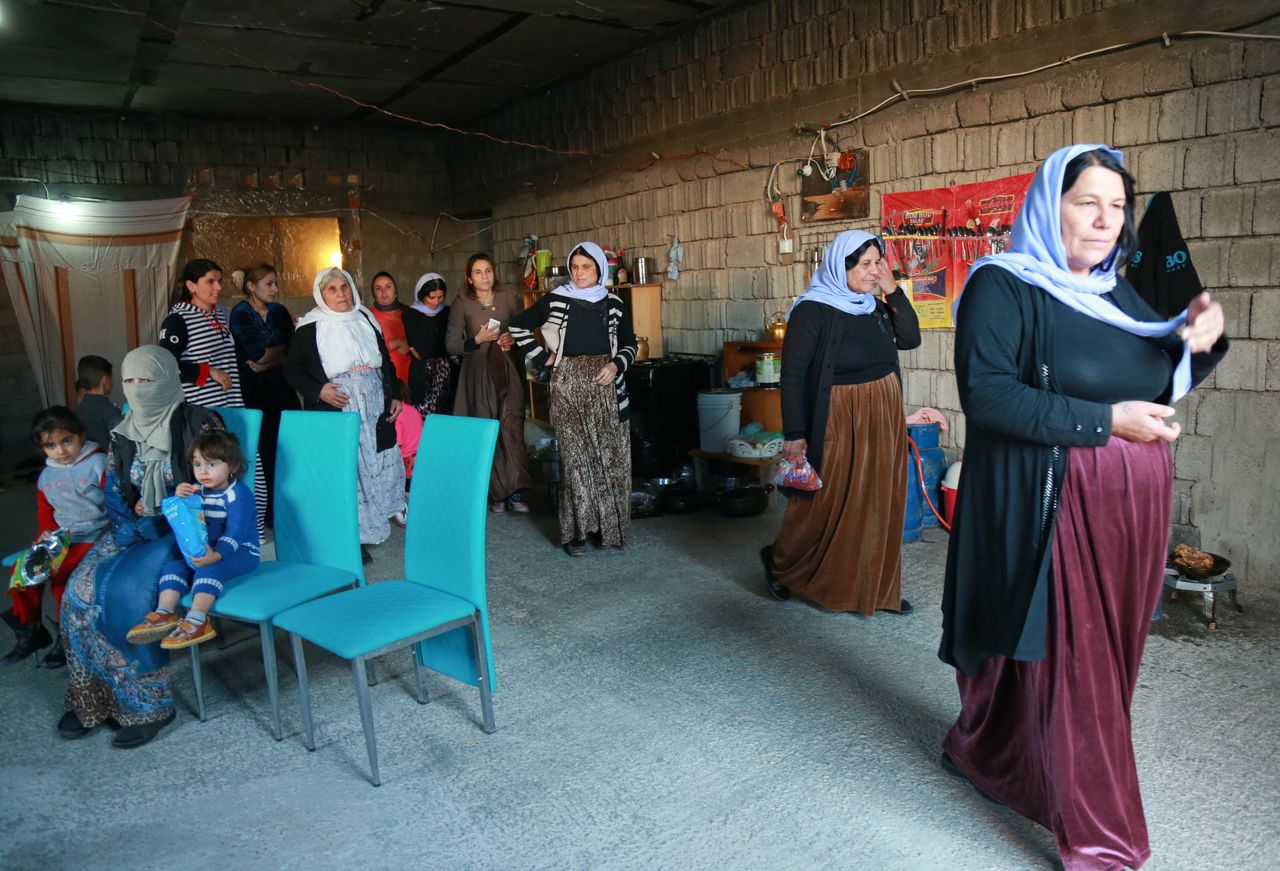 Displaced Yazidi women at a house in Duhok in northern Iraqi Kurdistan in November.