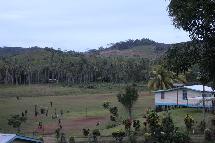 View of the school and playing fields in Naviavia village, in the center of the purchased land.