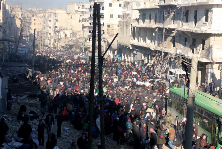 'Extreme rage' over international inaction in resolving the Aleppo crisis has prompted a demonstration in west London on Saturday; civilians in the Syrian city are pictured above being evacuated