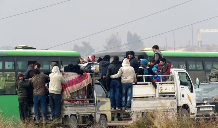 Syrians are evacuated from a rebel-held area of Aleppo on December 16