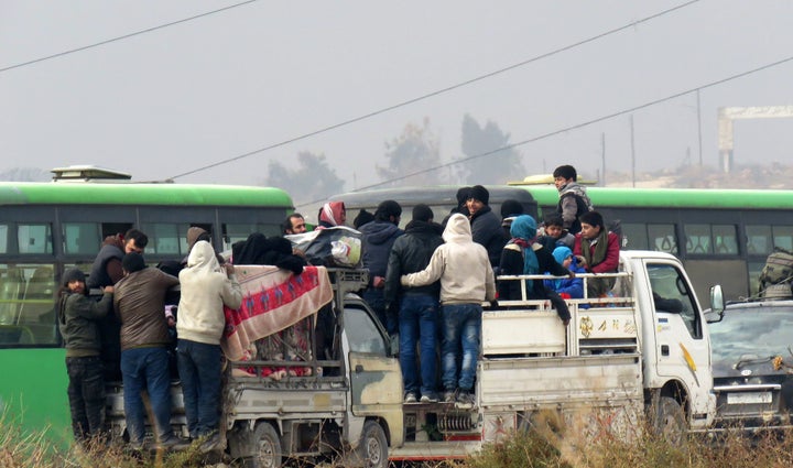 <strong>Syrians are evacuated from a rebel-held area of Aleppo on December 16</strong>