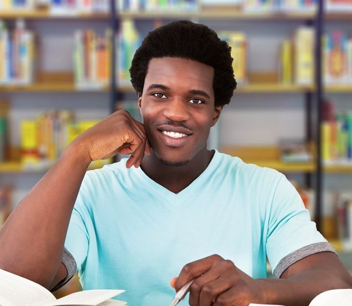 Young African Man Studying In College