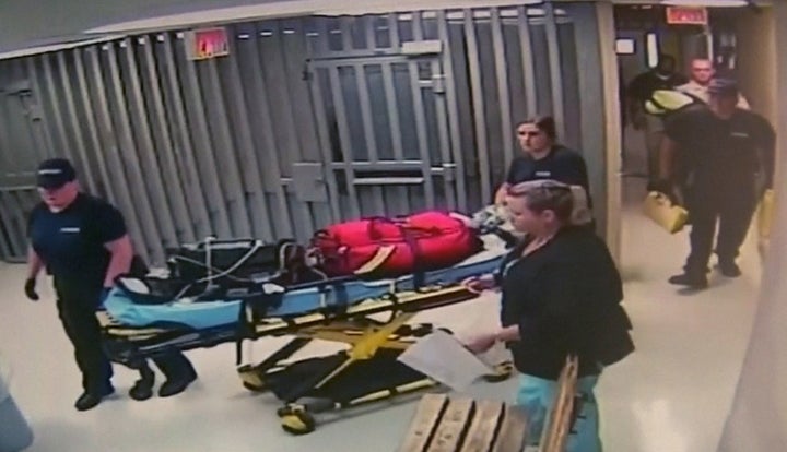 Medics leave with equipment on a stretcher at Waller County Jail in Hempstead, Texas, following the death of Sandra Bland, 28, on July 13, 2015.