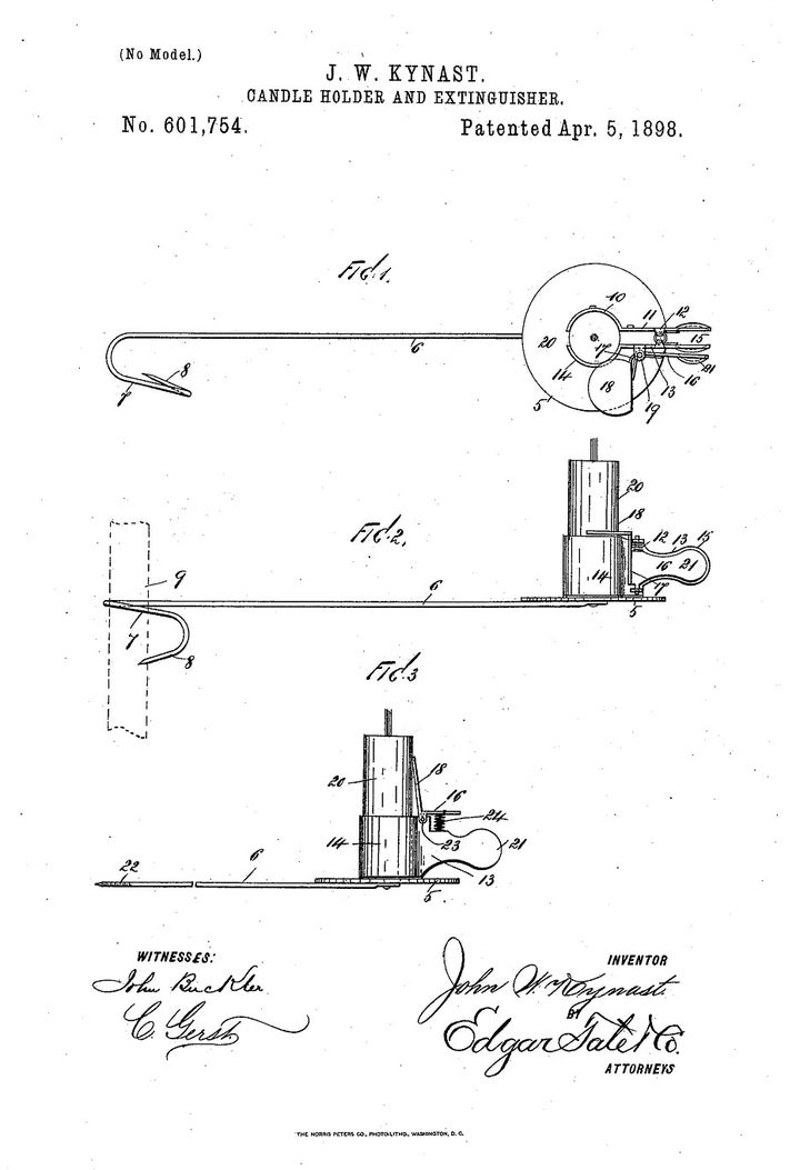 In this model, a long arm grasps the trunk of the tree and extends outward, so the candle doesn’t have to be attached to the branch. A clamp to keep the candle in place and a built-in extinguisher are also included. This patent was awarded in 1898. 