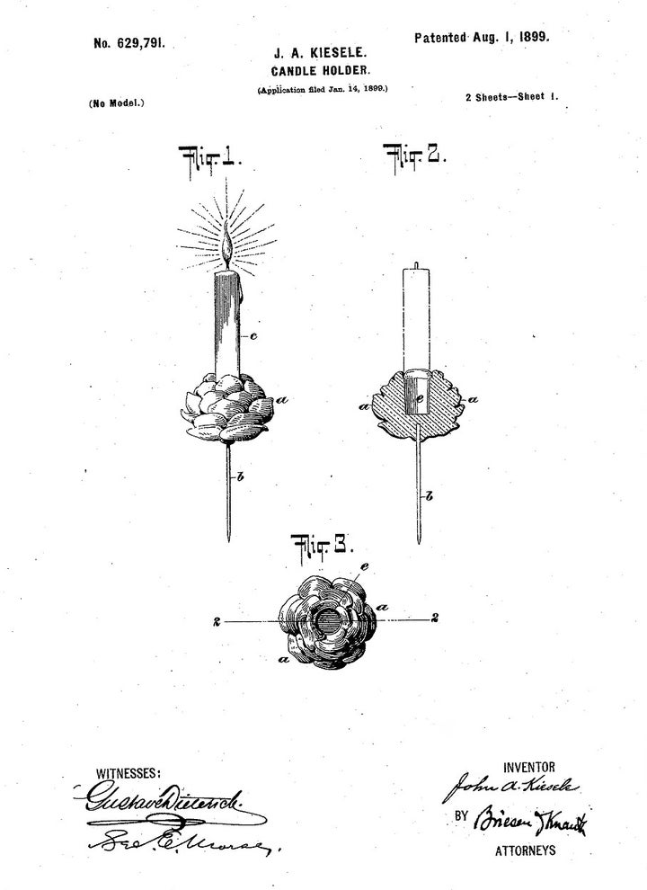 In 1899, this patent was awarded for a Christmas tree candle holder with a pine cone base. It’s mounted on a spike, which attaches the holder to the tree branch or a wreath. 